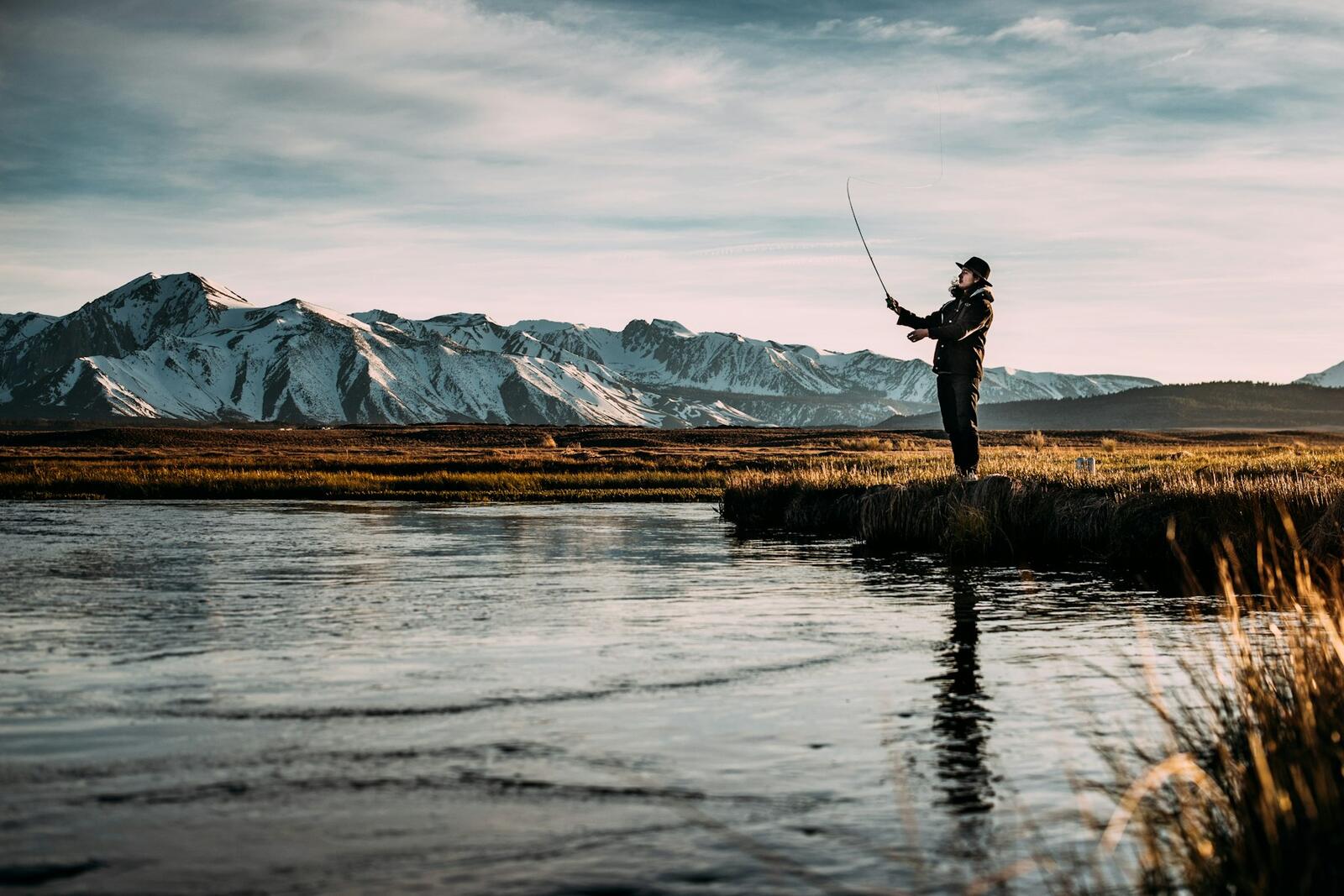 An angler with a rod, representing the Big Fish Tackle storefront
